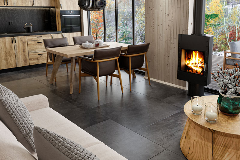 warm room with a dark stone tile floor