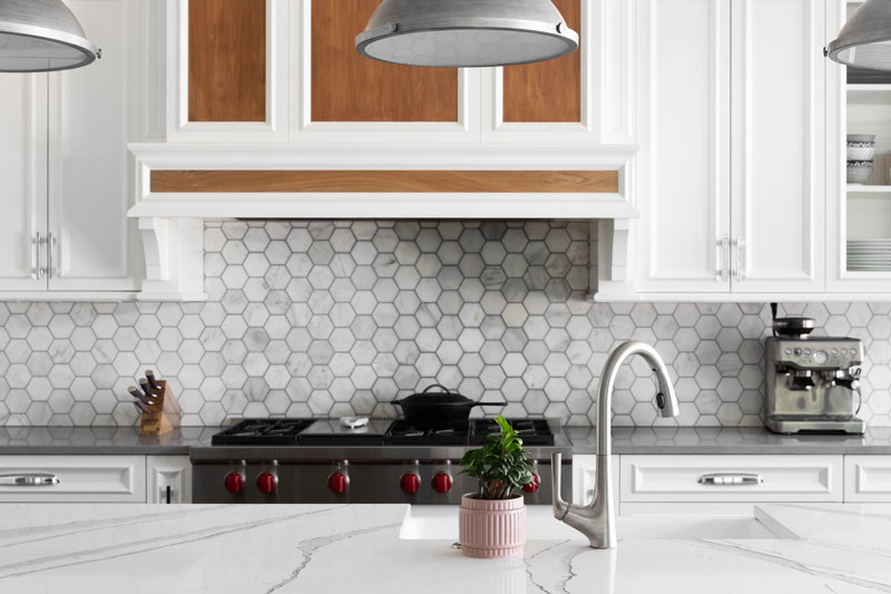 Kitchen with a hex patterned backsplash